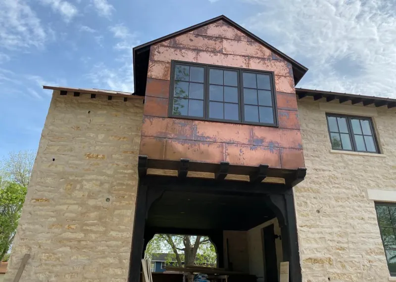 Copper metal panel facade on a stone building for Metal Roof Coating in Dranesville