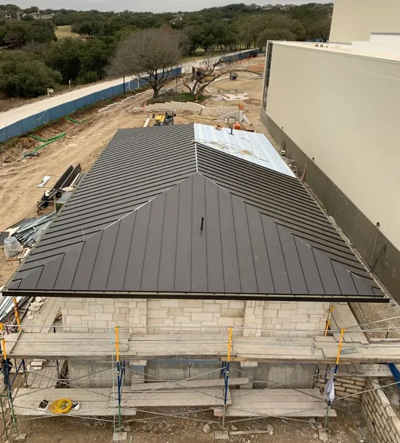 Metal roof new construction with scaffolding in Dranesville